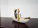 African Canoe + Passengers