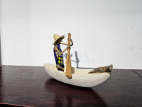 African Canoe + Passengers
